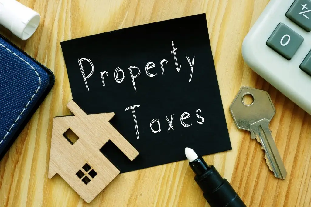 Property taxes are shown on a photo using the text